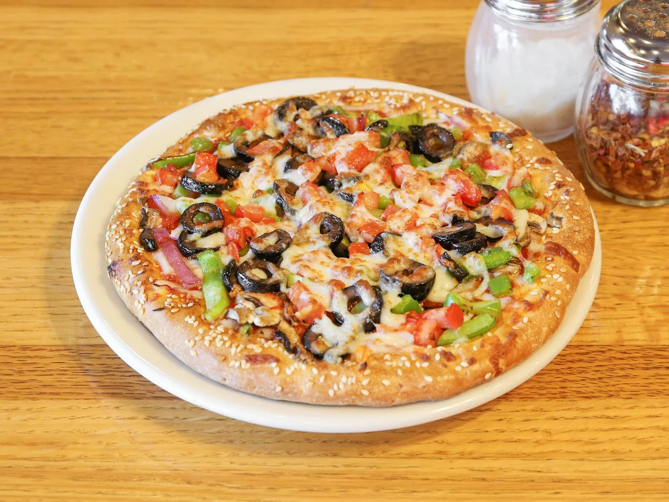 Fresh baked City Pizza vegetarian pie with our famous sesame seed crust